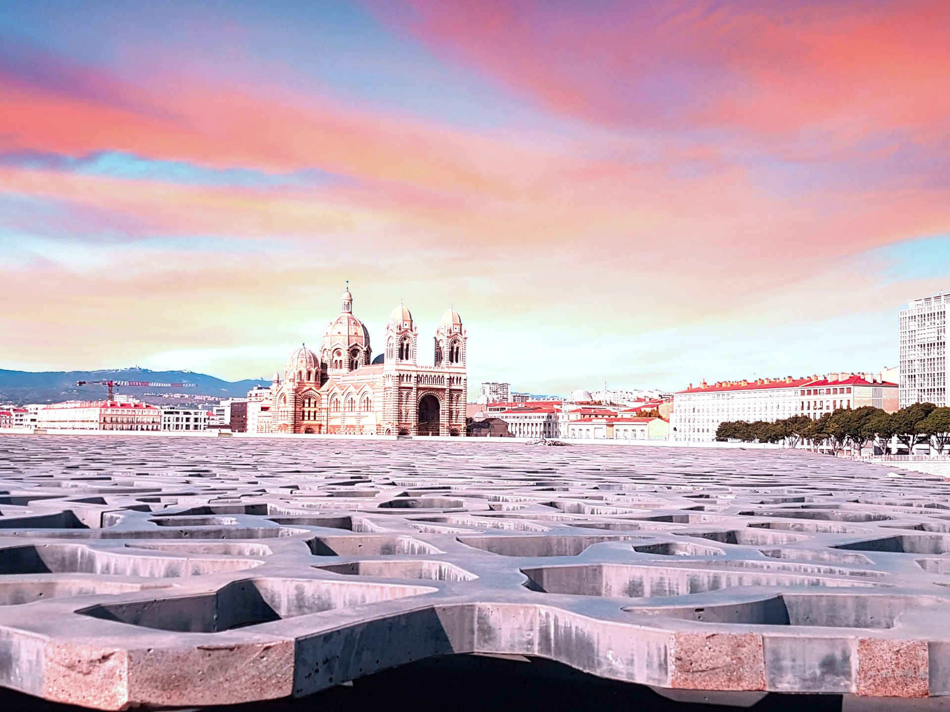 Reflects of the pink sky on the city of Marseille